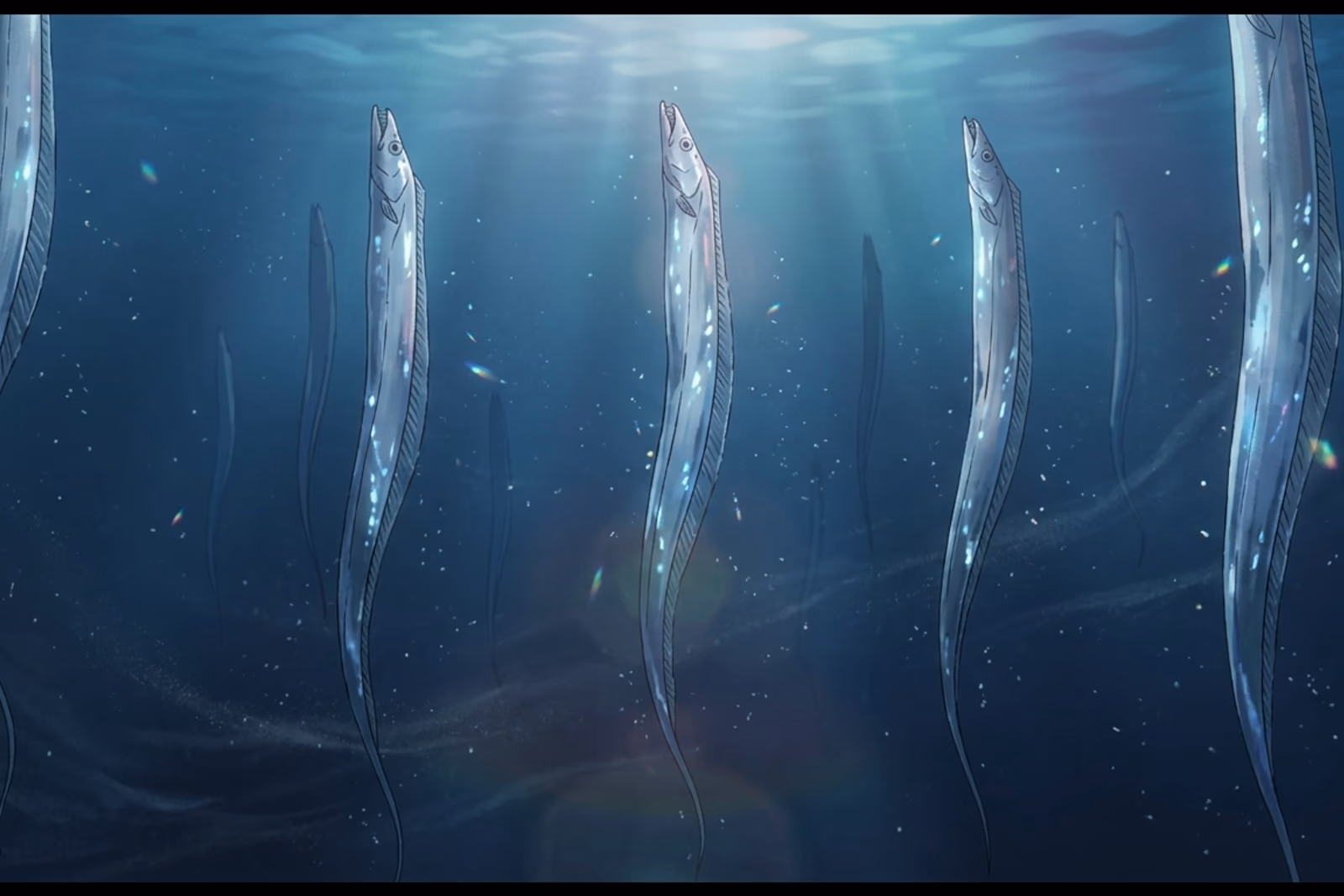 深藍海水中央,一群銀帶魚頭朝上、幾乎垂直地懸浮其間