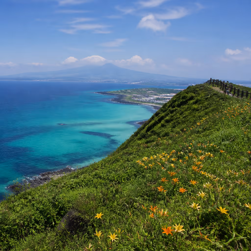 Seowoobong summit ridge with a western view of the emerald Hamdeok sea and low Hallasan silhouette